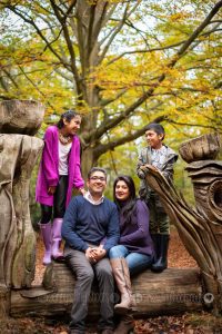 Outdoor family photography in the woods - family of 4 on log