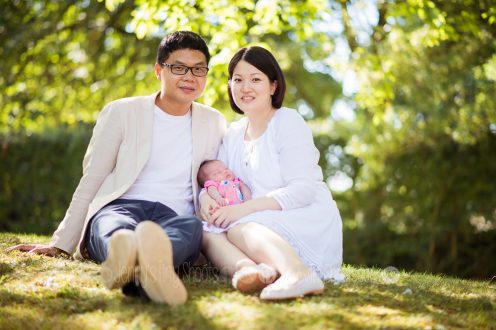 Family outdoors with their new baby