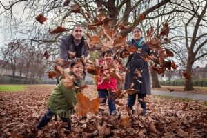 family fun autumn portrait with leaves