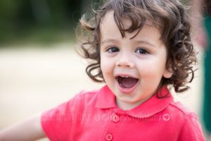 Laughing toddler outside