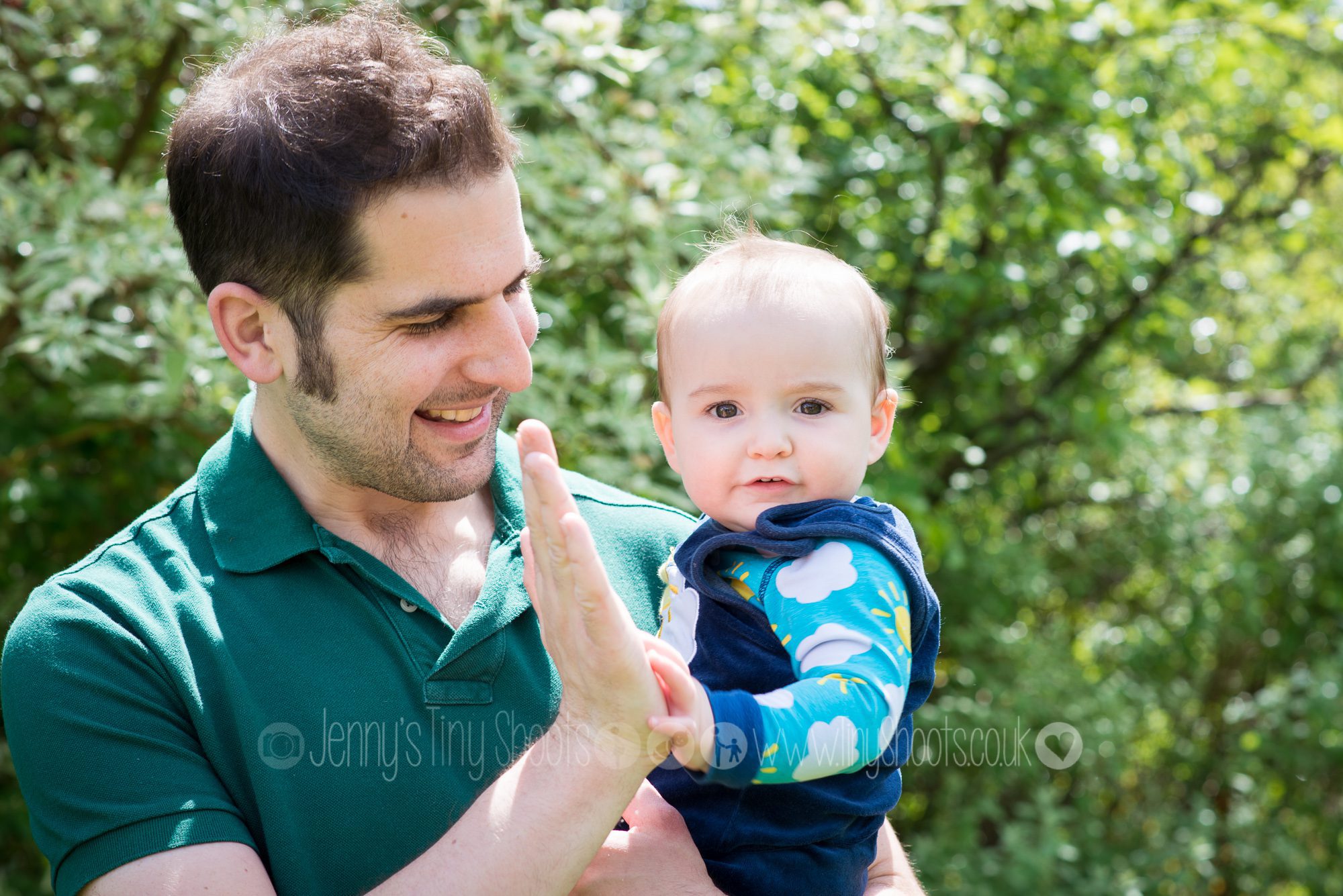 Daddy and baby portrait in the garden