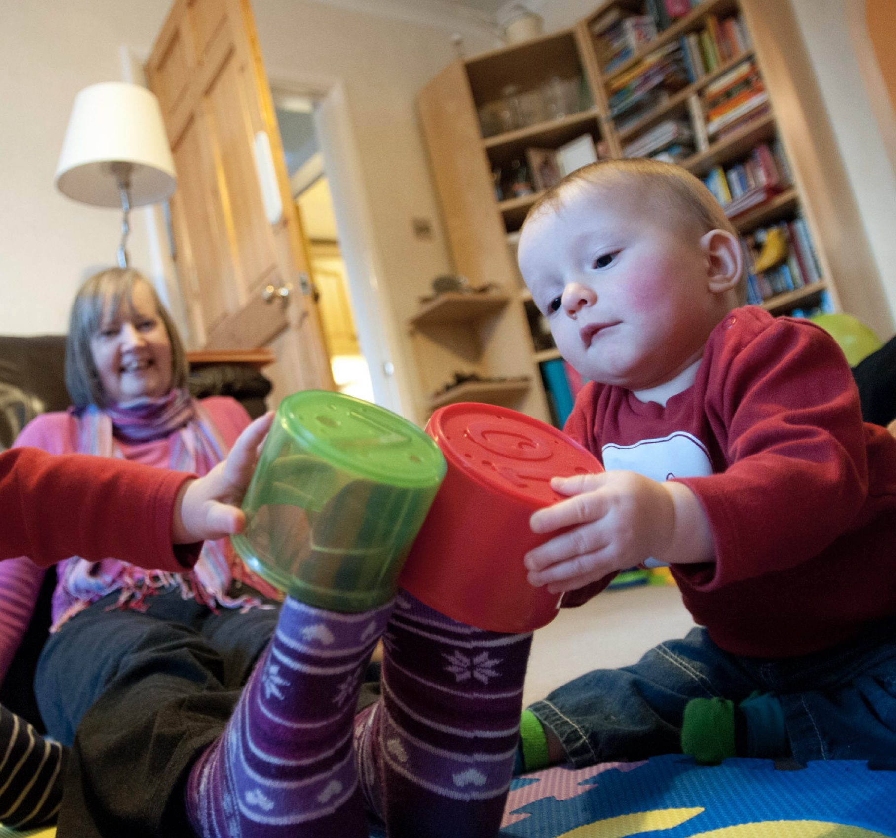 baby playing with granny