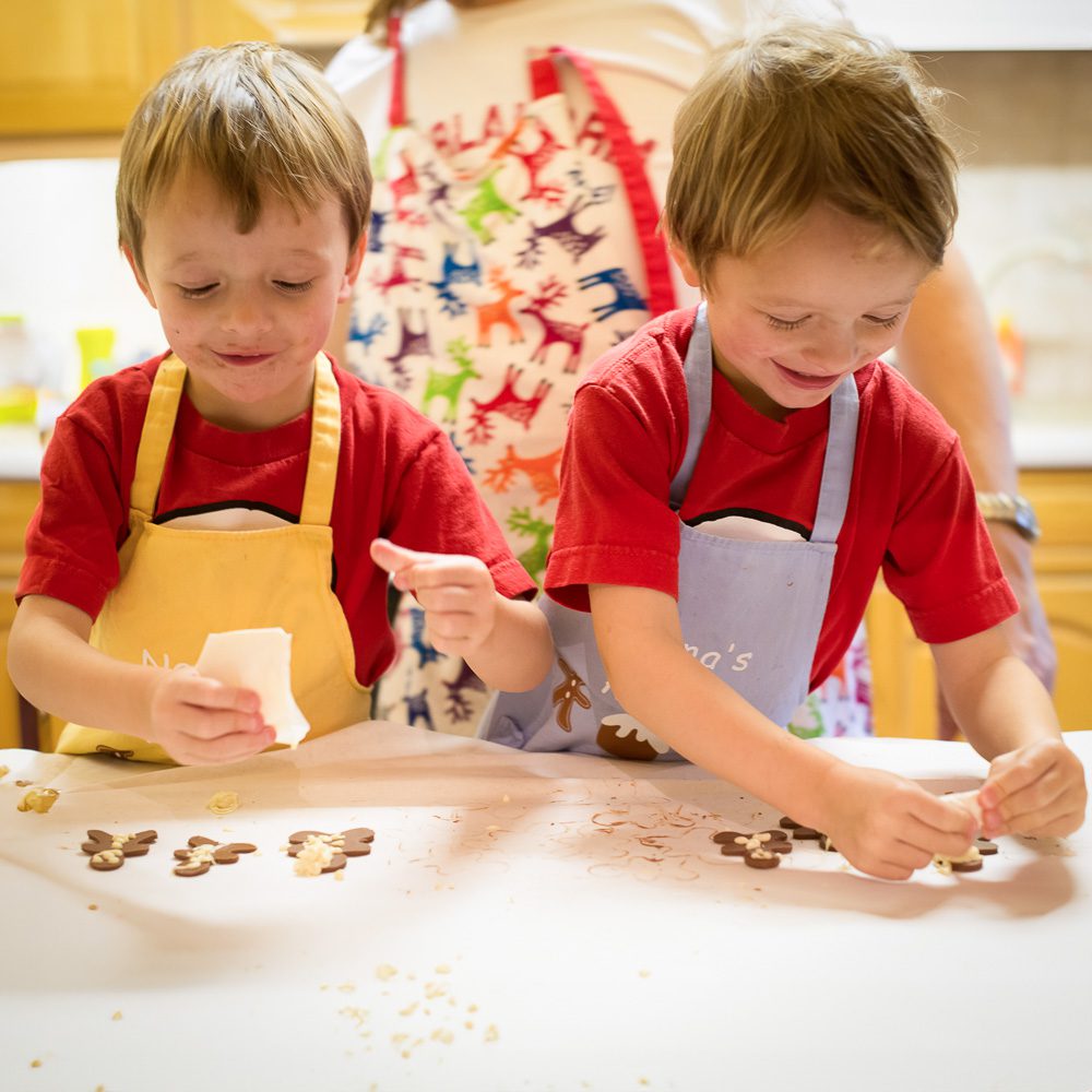 2 boys cooking making Christmas treats