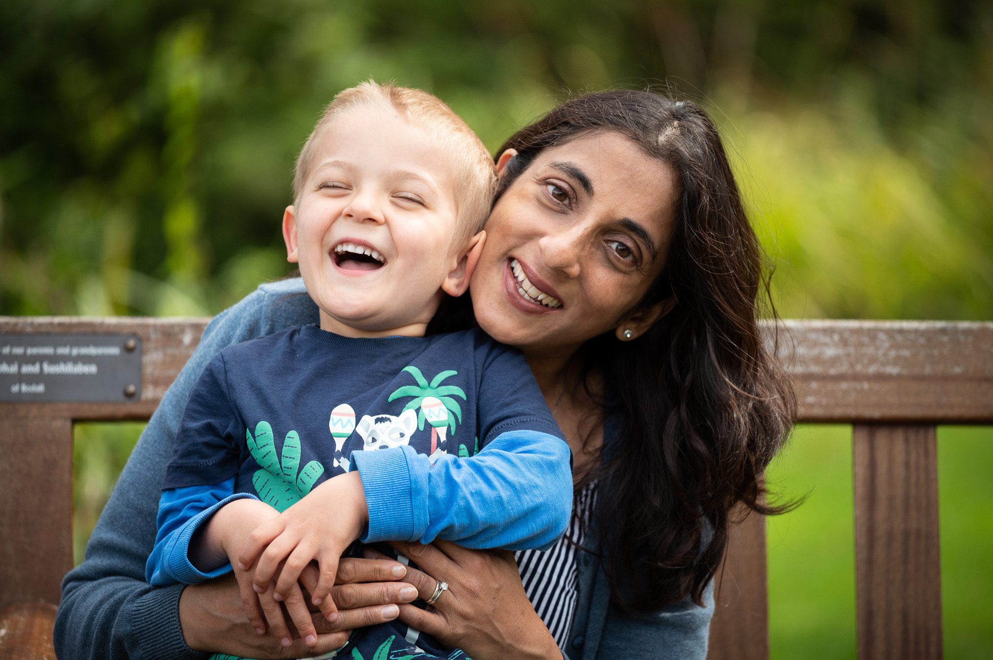 boy laughing with his mum