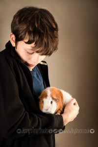 Boy with teddy guinea pig - portrait