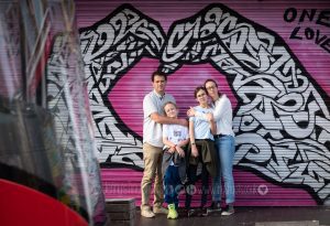 City family photo with graffiti