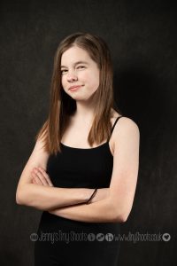 Young actor headshot with attitude crossed arms