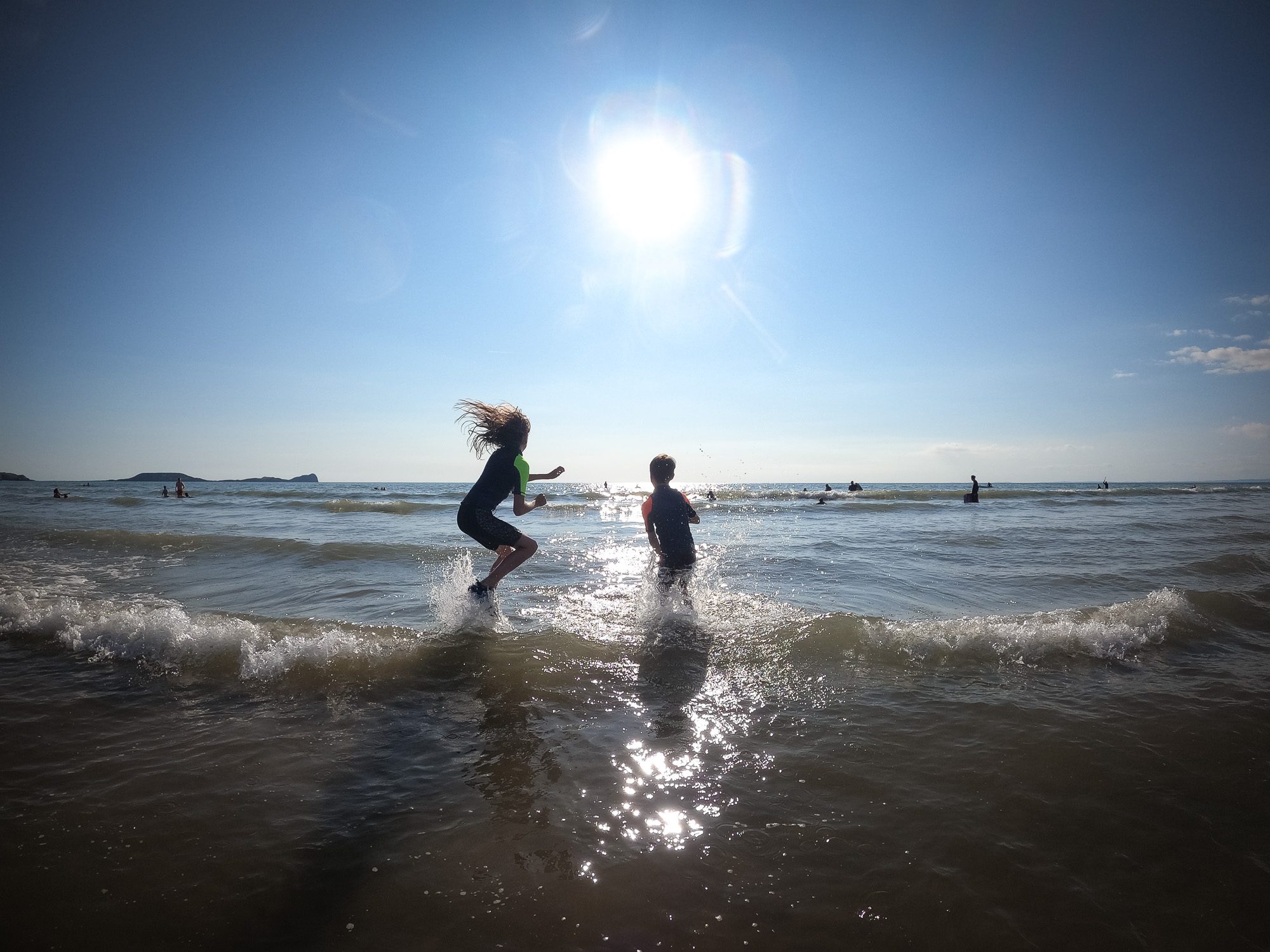 Twins playing in the sea