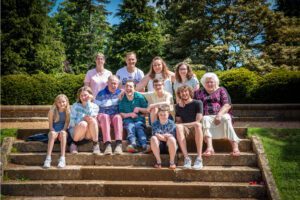 Outdoor family photoshoots for the whole family with this big family group portrait