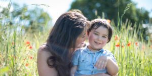 mum and child in poppy field