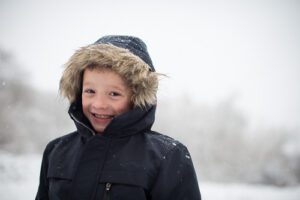outdoor portrait of boy in snow