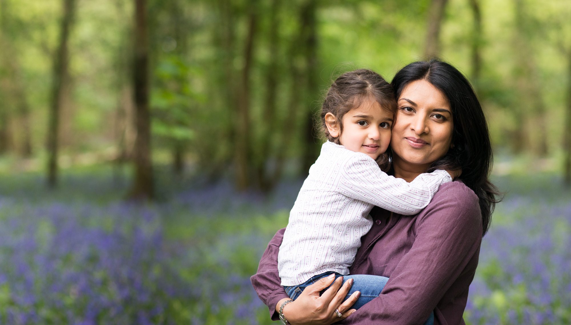 Mother and daughter portrait in the bluebells
