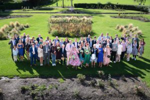 A group photo of all the guests at this colourful none traditional wedding